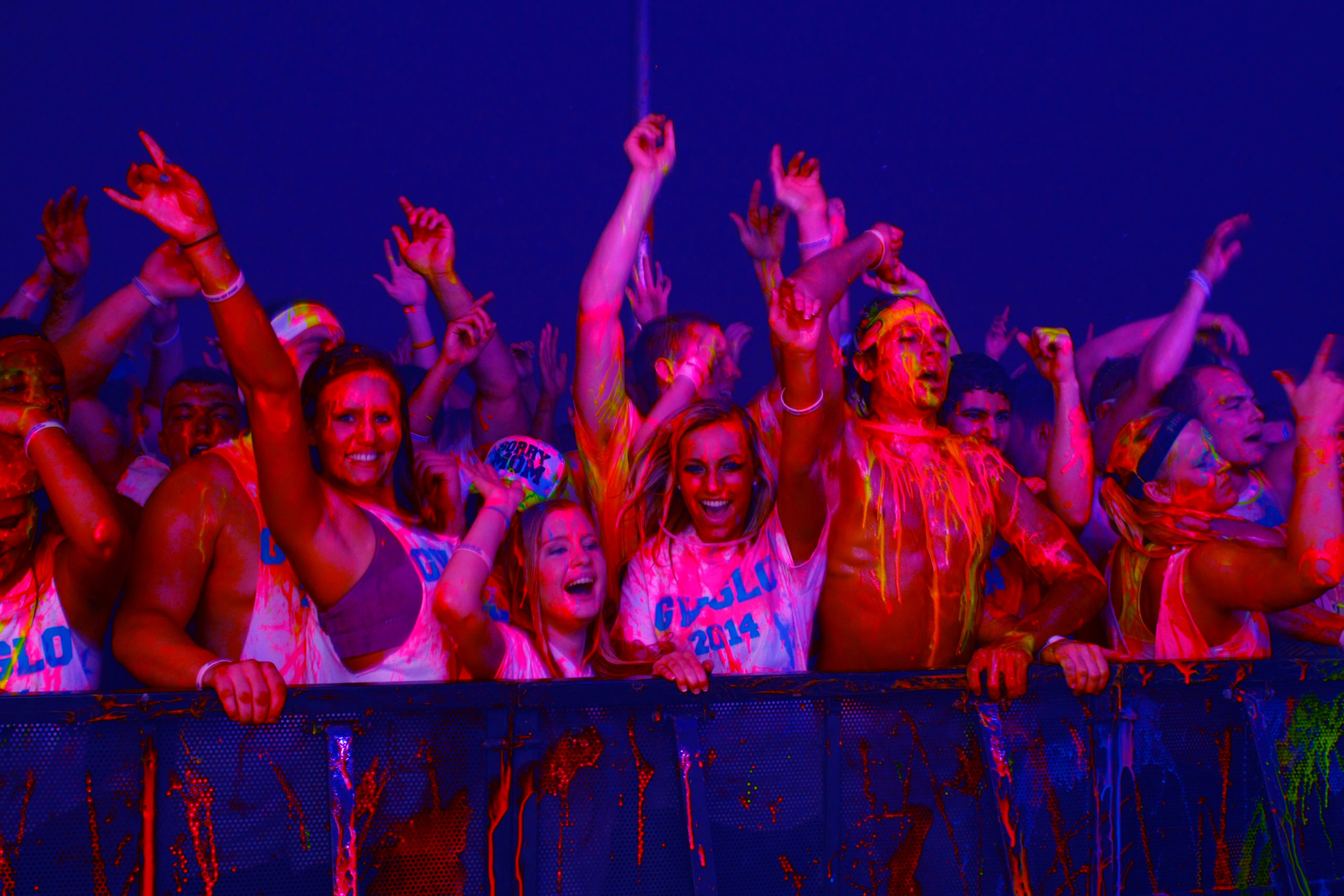 Attendees enjoying and participating in the Operation Glow Paint Party.