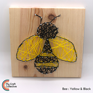 Bumble Bee string art made with yellow and black string.