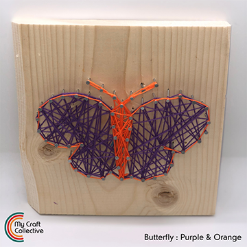 Butterfly string art made with purple and orange string.