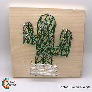 Cactus string art made with green and white string.