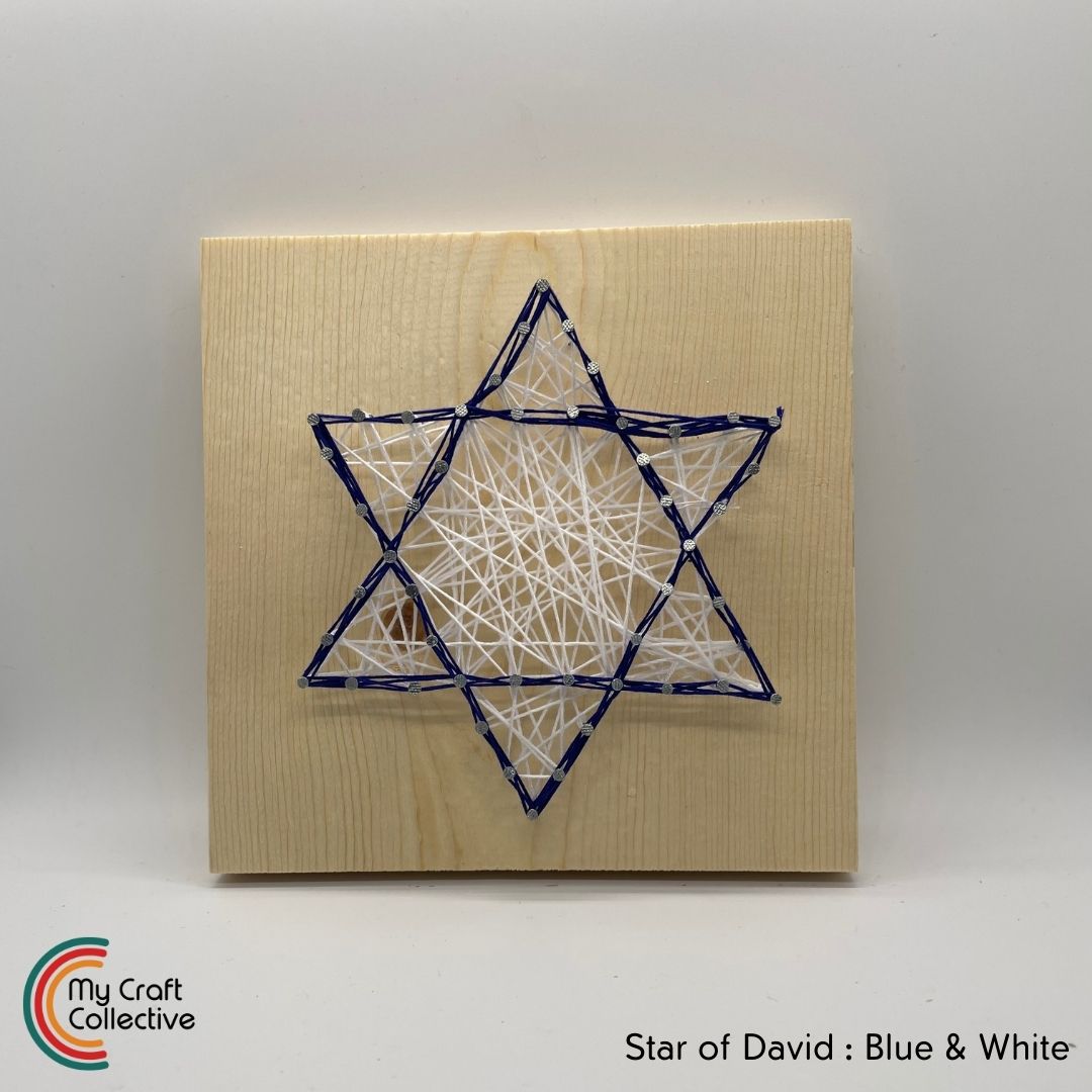 Star of David string art made with blue and white string.