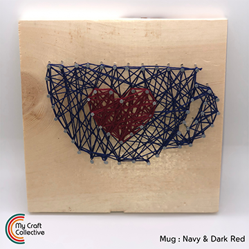 Heart mug string art made with red and navy string.