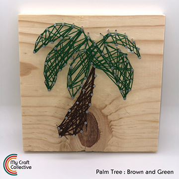Palm tree string art made with green and brown string.