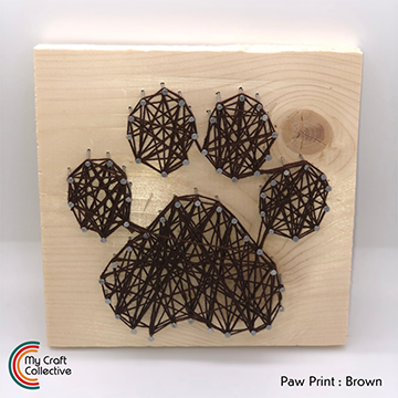 Paw print string art made with brown string.