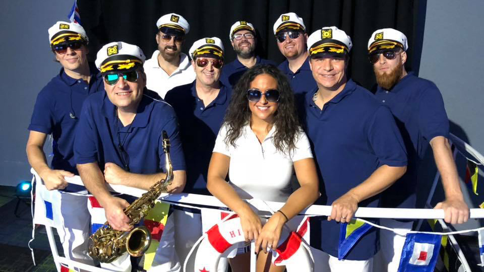 Members of the Yacht Rock cover band, Smooth Sailing, dressed in boating clothes.